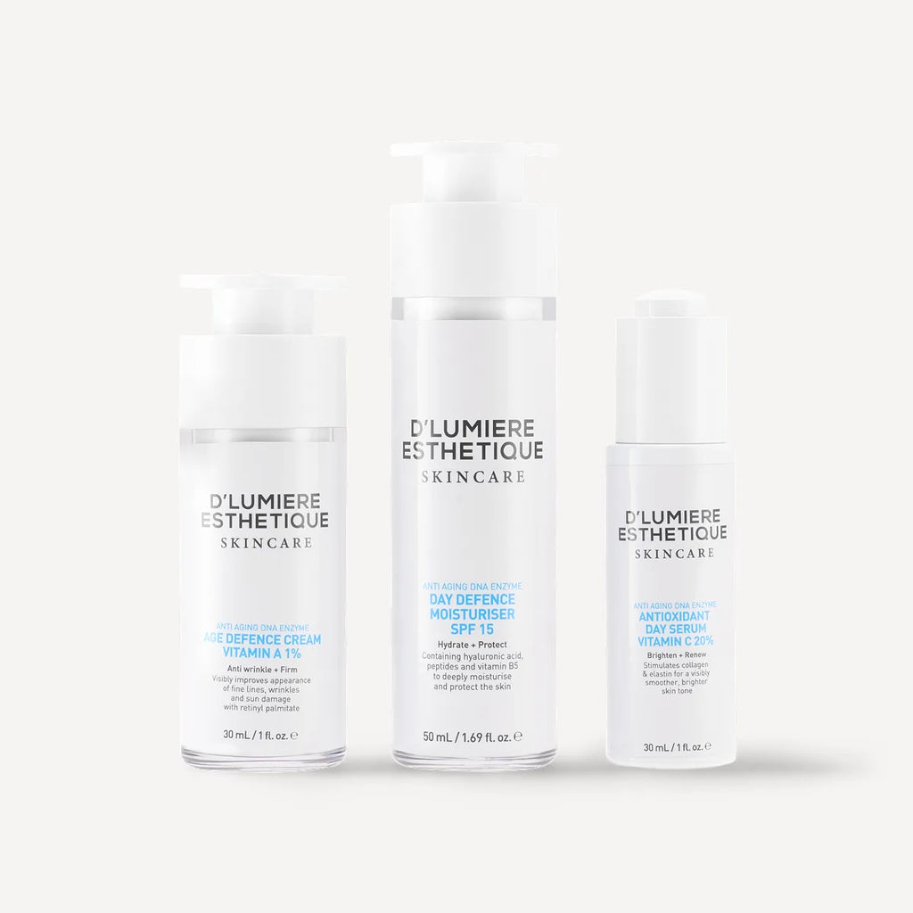 Three bottles of D'lumiere Esthétique skincare products on a white background