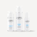 Three bottles of D'lumiere Esthétique skincare products on a white background
