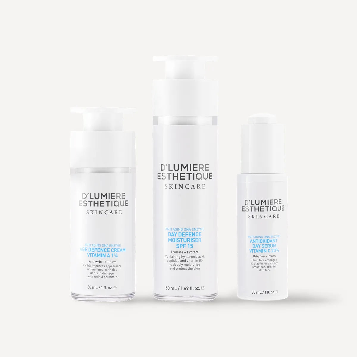 Three bottles of D'lumiere Esthétique skincare products on a white background