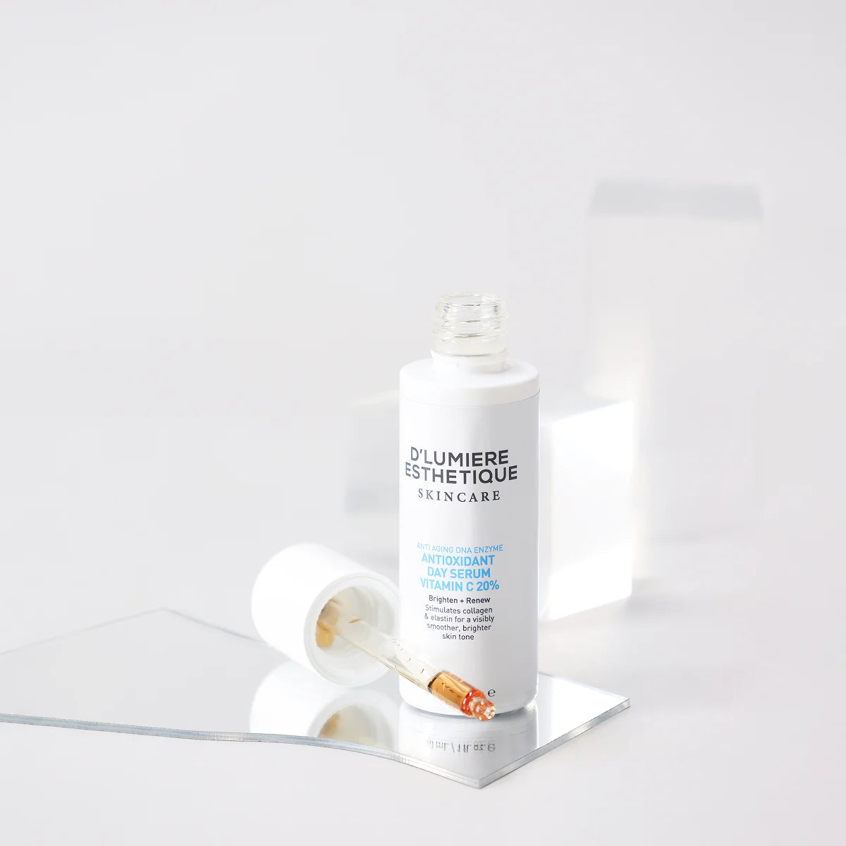 Skincare product with dropper on a white background
