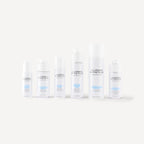 Set of skincare bottles labeled 'Lumiere Esthetique' on a white background