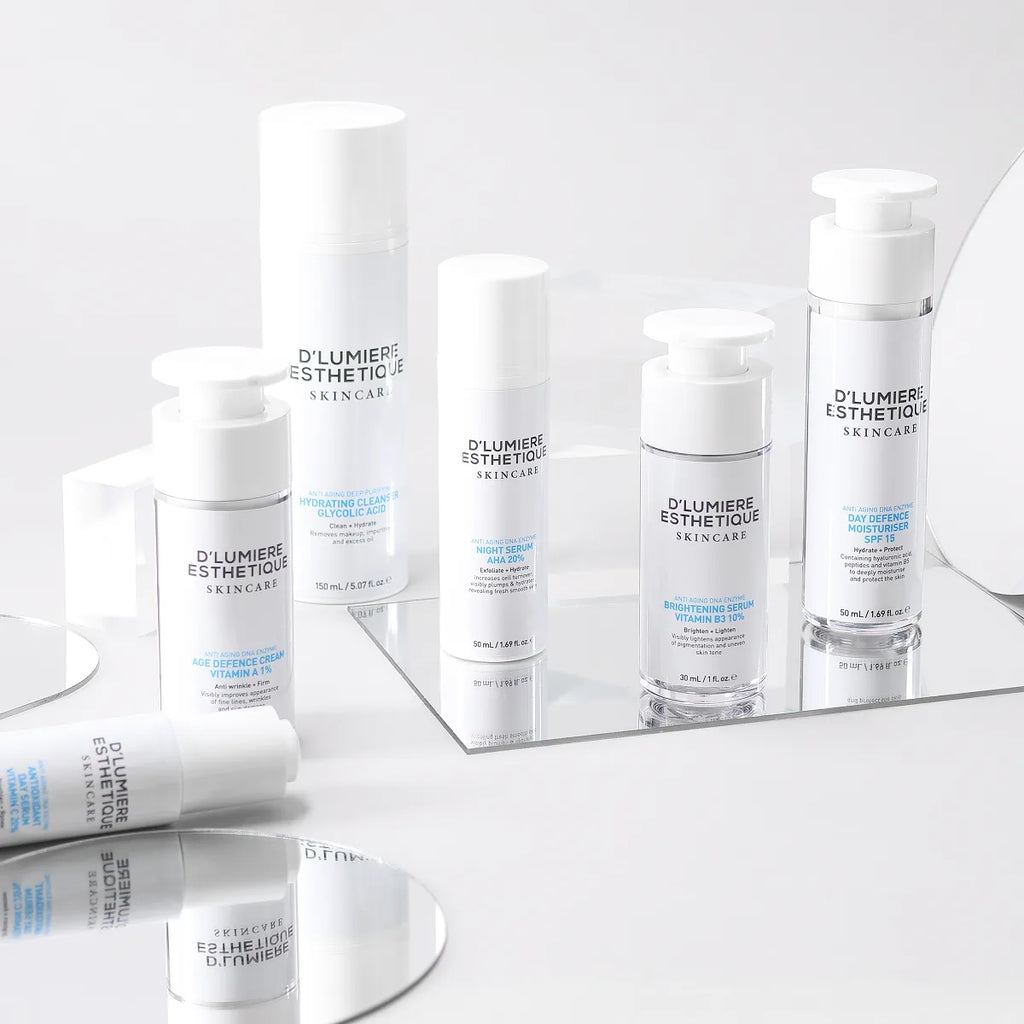 Délumèrie Esthétique skincare products on a white surface with a mirror reflection.