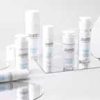 Délumèrie Esthétique skincare products on a white surface with a mirror reflection.