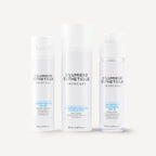 Three bottles of D'Lumiere Esthetique skincare products on a white background