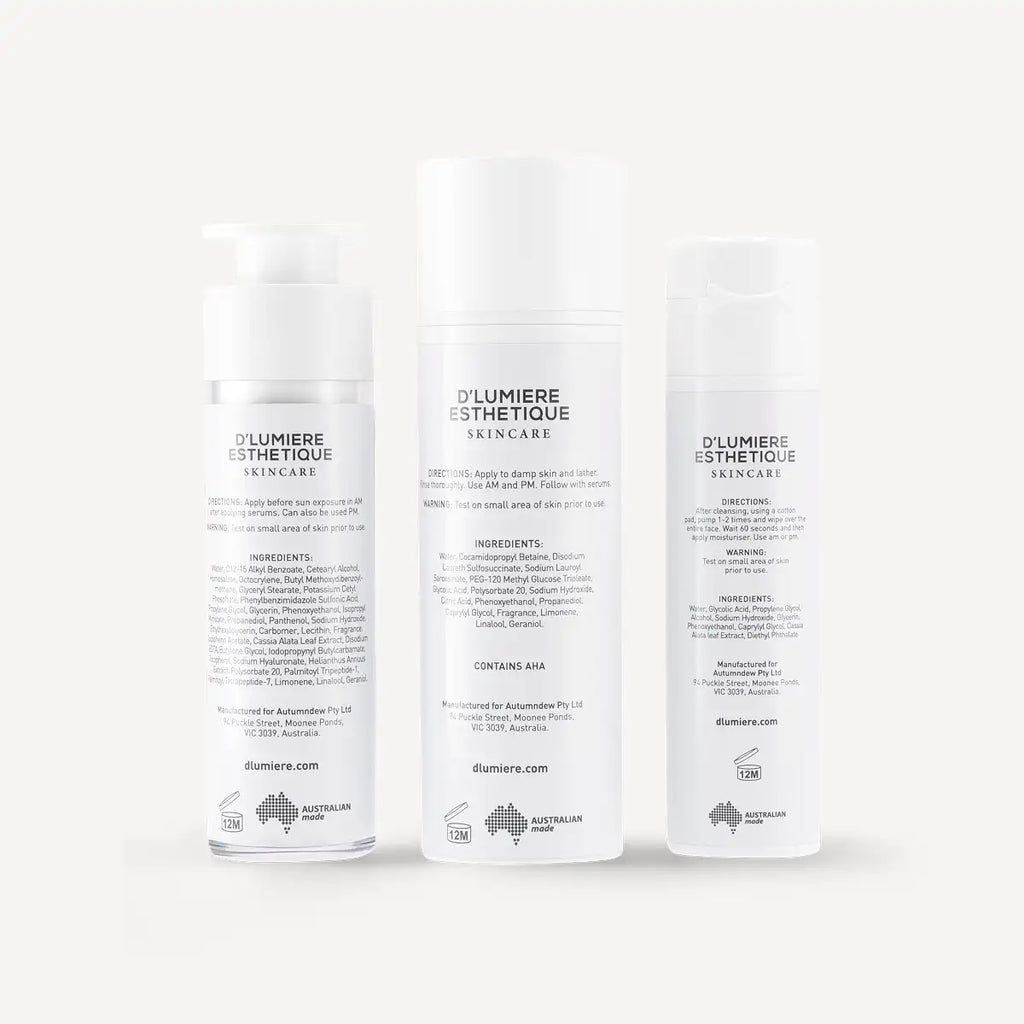 Three bottles of D'lumiere Esthetique skincare products on a white background