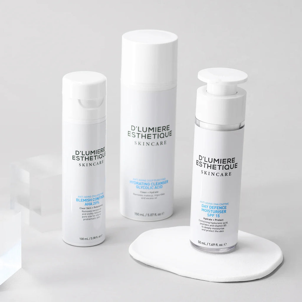 Three skincare products from D'Lumiere Esthetique on a white background