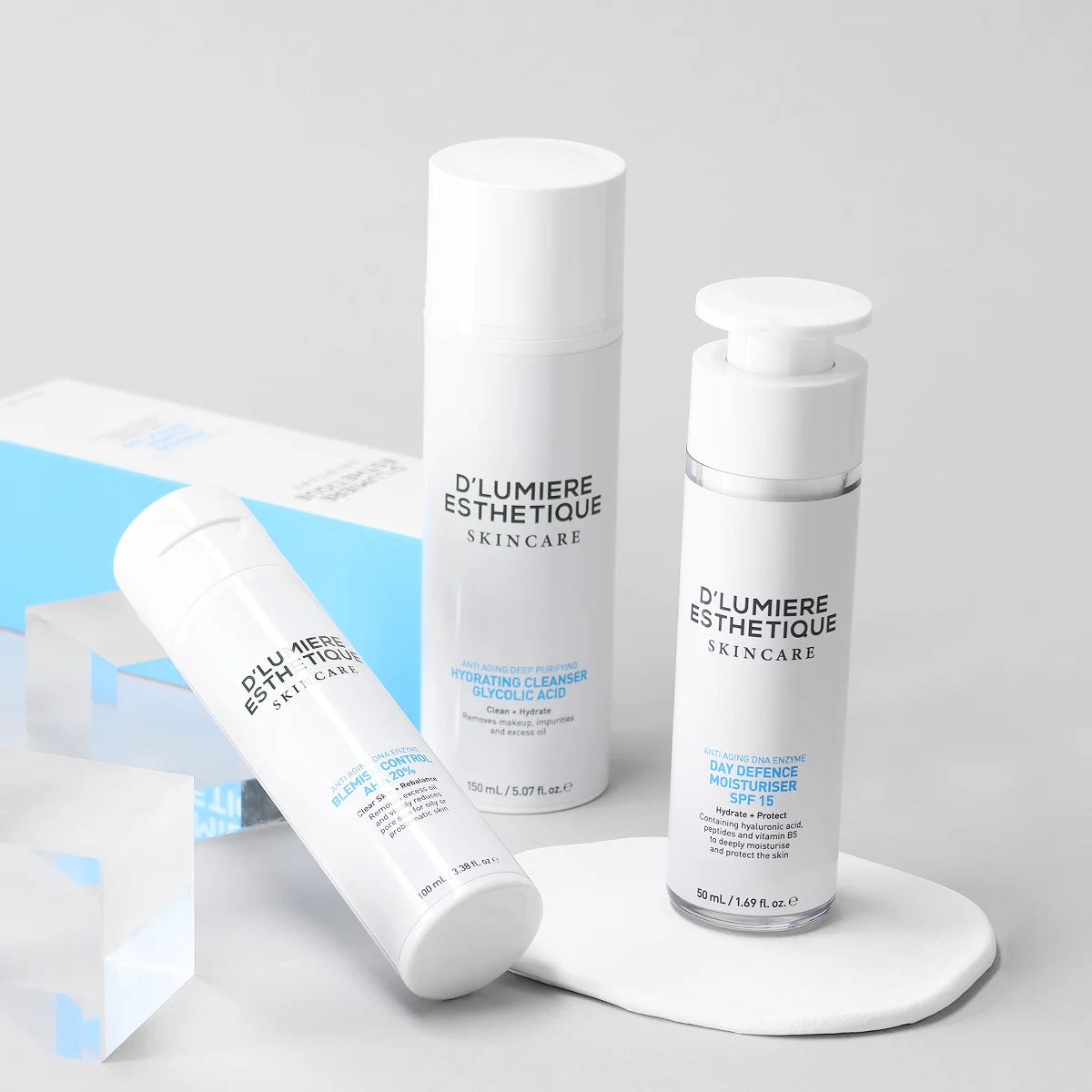 D'lumiere Esthetique skincare products on a light gray background