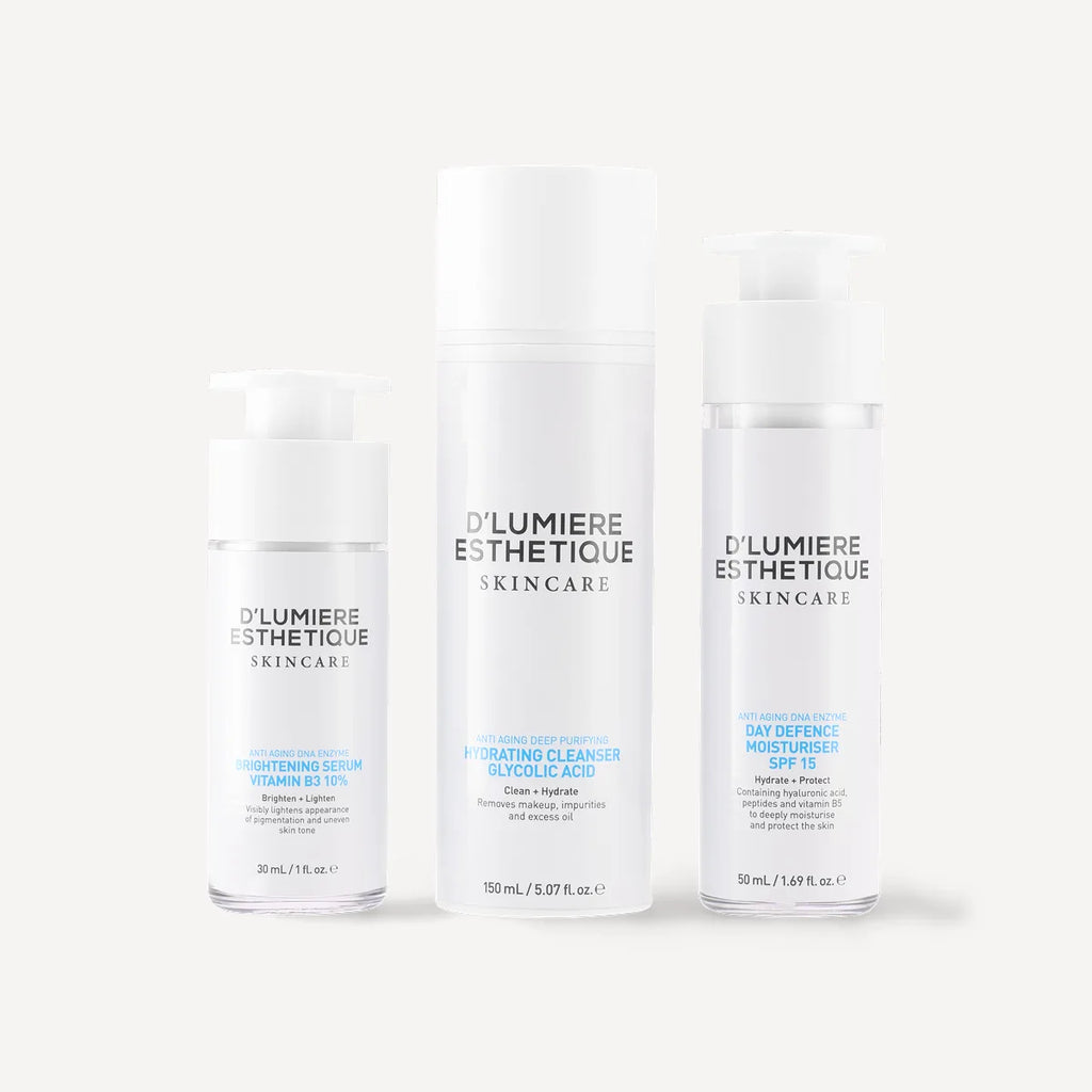 Three skincare bottles from D'Lumiere Esthetique on a white background